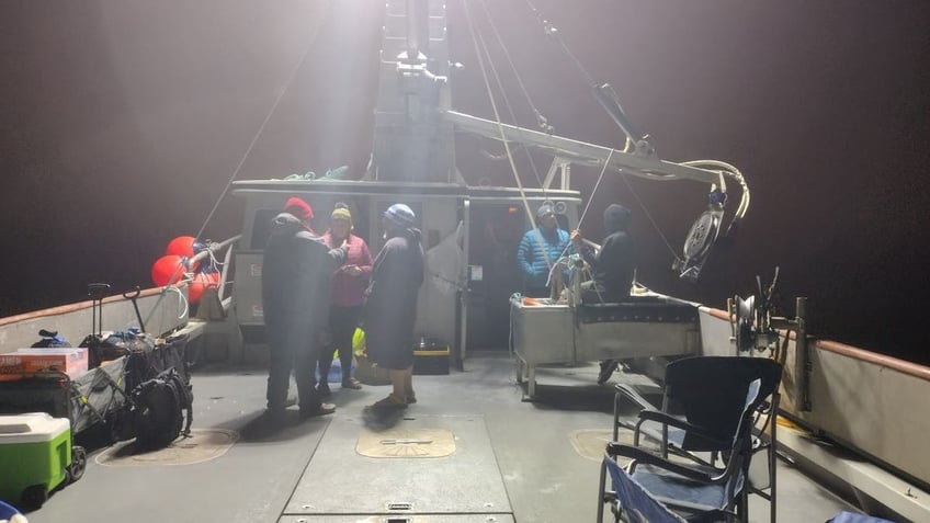 Wide shot of deck of boat in Pacific Ocean