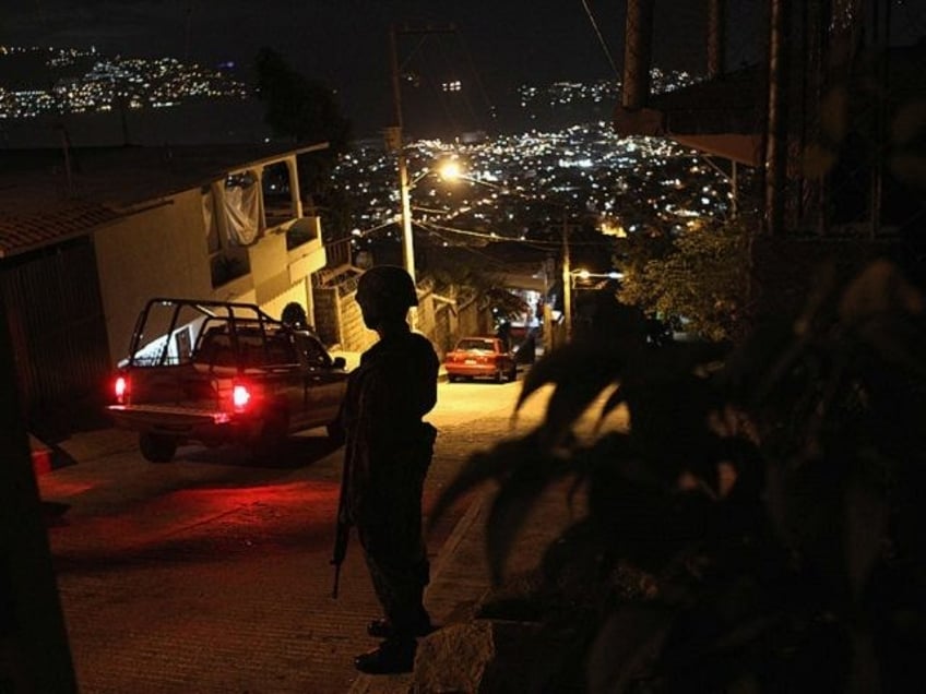 ACAPULCO, MEXICO - MARCH 03: A Mexican army soldier stands guard at a suspected drug-rela