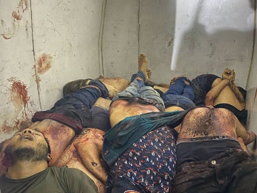 graphic mexican cartel violence leaves four headless bodies hanging from bridge 16 others killed