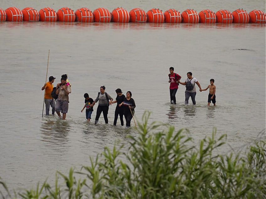 graphic photos cops find body of migrant caught in texas border buoys