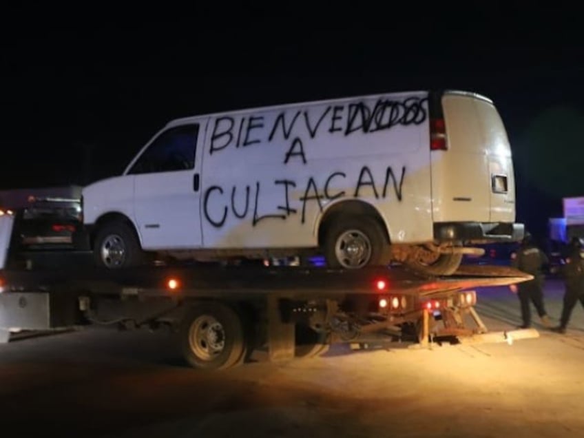 graphic sinaloa cartel gunmen pack bodies in van as hundreds killed taken amid turf war