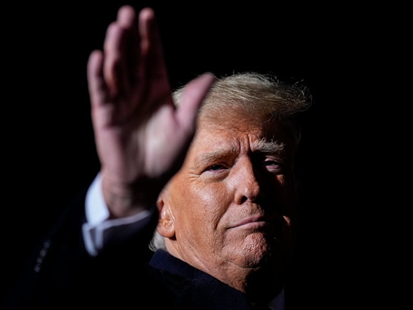 VANDALIA, OHIO - NOVEMBER 07: Former U.S. President Donald Trump waves at the end of a rally at the Dayton International Airport on November 7, 2022 in Vandalia, Ohio. Trump is in Ohio campaigning for Republican candidates, including U.S. Senate candidate JD Vance, who faces U.S. Rep. Tim Ryan (D-OH) in tomorrow's general election. (Photo by Drew Angerer/Getty Images)