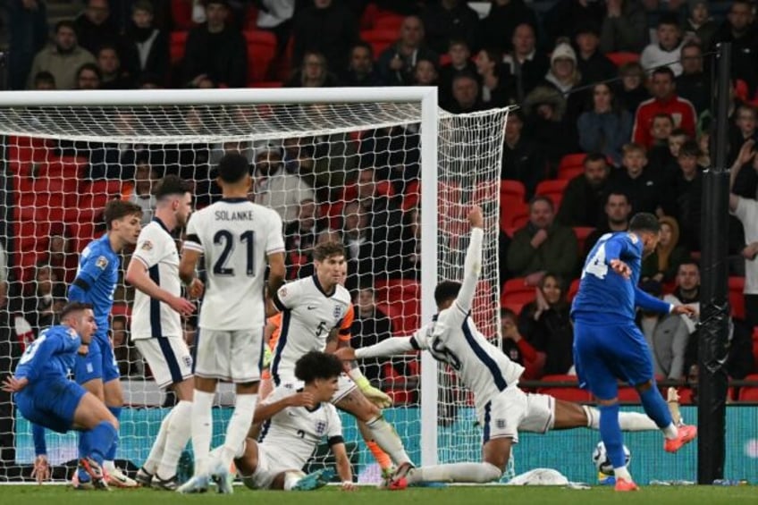 Vangelis Pavlidis (R) scoring Greece's winner against England