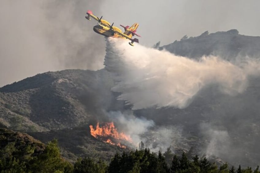 greece faces new heatwave as wildfires rage
