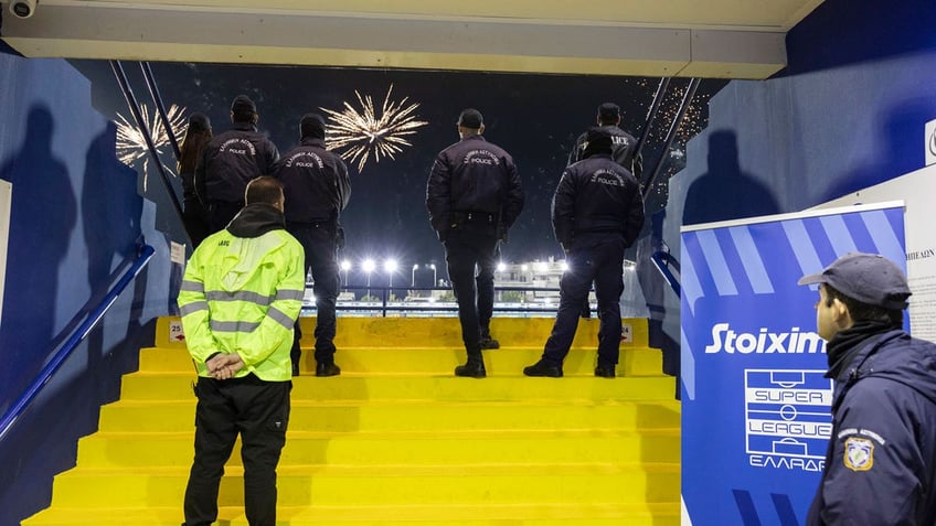 Greek police secure an entrance of a stadium during a Greek super League soccer match between Atromitos and Panathinaikos at Peristeri stadium