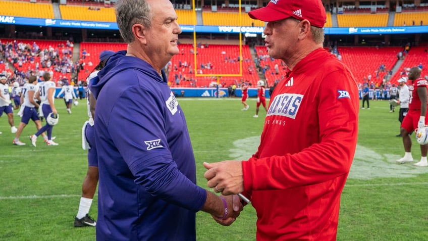 TCU head coach Sonny Dykes and Kansas head coach Lance Leipold meet after TCU defeated Kansas at Arrowhead Stadium. (Photo by Kyle Rivas/Getty Images)