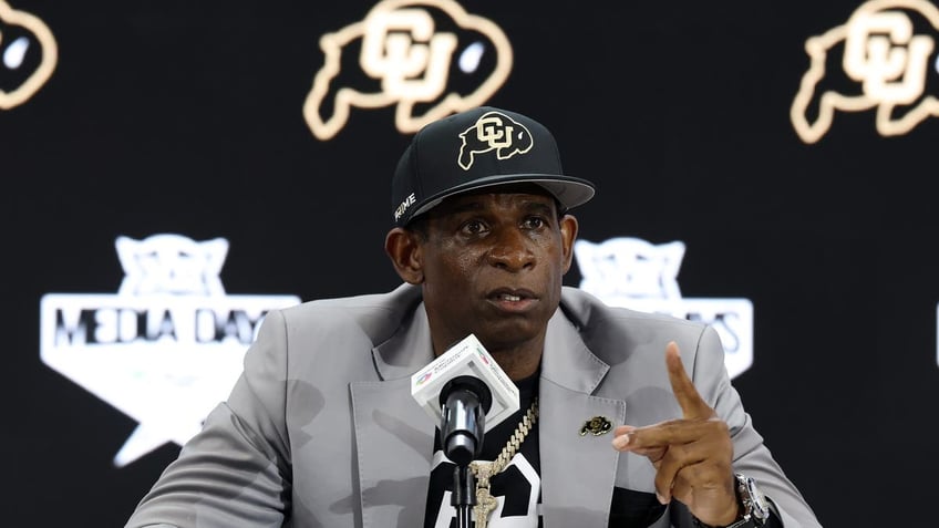 Head coach Deion Sanders of the Colorado Buffaloes speaks with the media during the Big 12 Media Days. (Photo by Stacy Revere/Getty Images)
