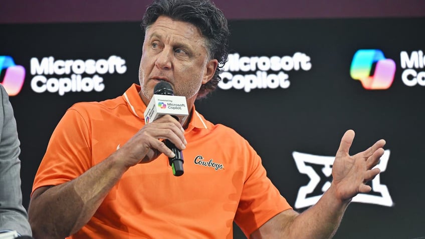 Oklahoma State coach Mike Gundy speaks during a coaches roundtable during Day 2 of Big 12 Media Days. (Photo by Austin McAfee/Icon Sportswire via Getty Images)