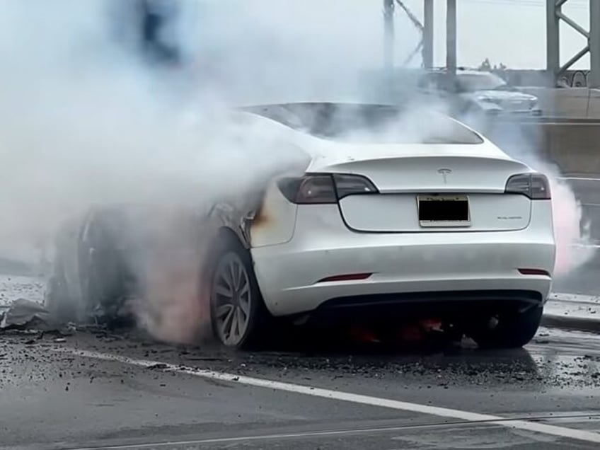 green inferno tesla model 3 engulfed in flames after hitting debris on new jersey road