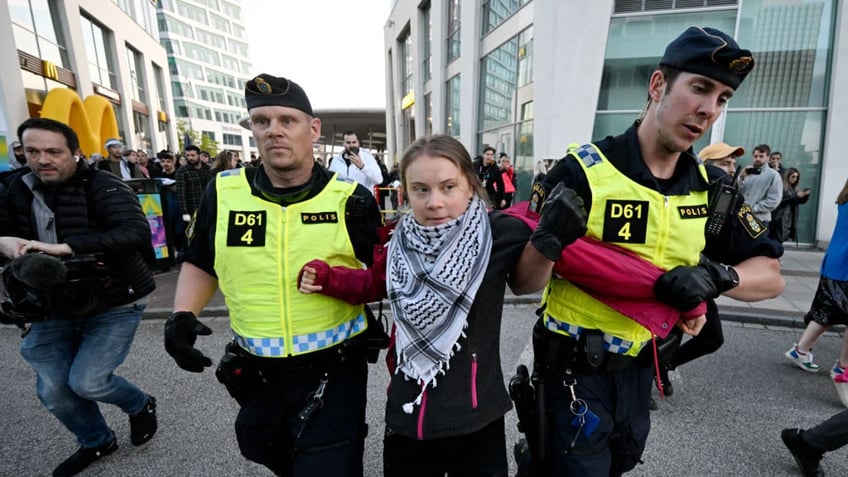 Greta Thunberg has participated in several anti-Israel protests in recent months. She is pictured here being arrested in Sweden at Eurovision 2024 in May.