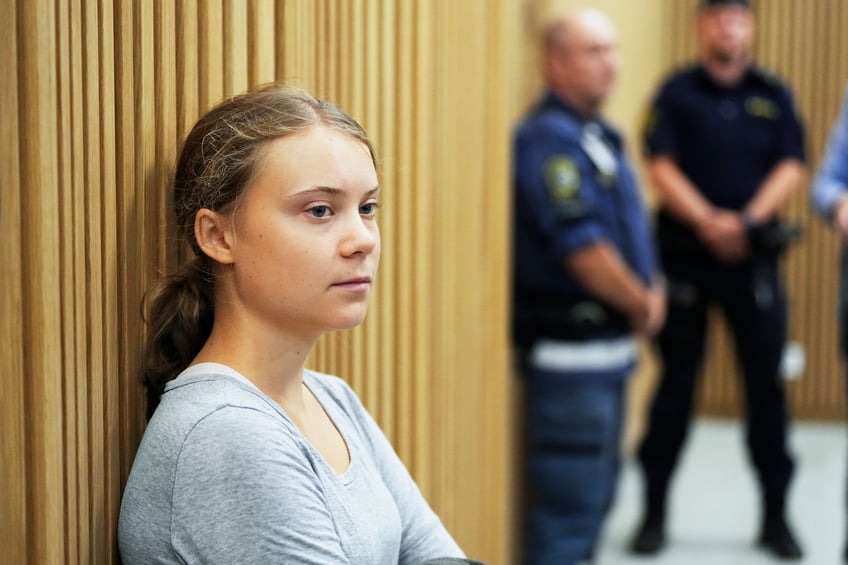 greta thunberg dragged out of oil facility by police claims crime is self defense from fossil fuels