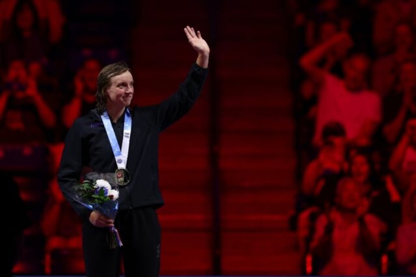 Paris bound: Katie Ledecky acknowledges fans after winning the 400m freestyle at the US Ol