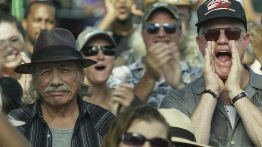 eric dane cheering in a crowd