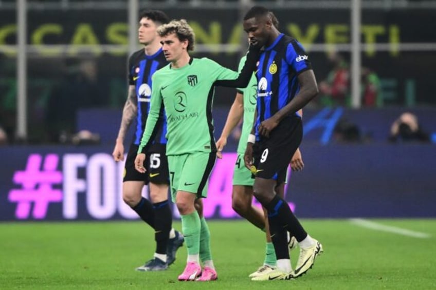 Atletico Madrid's French forward Antoine Griezmann (C) is in line to return to face Inter