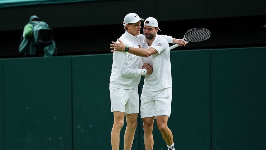 Grigor Dimitrov and Jannik Sinner embrace