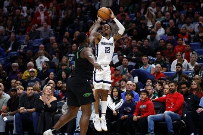 Back in action: Memphis Grizzlies star Ja Morant back after a 25-game NBA suspension, shoots over Zion Williamson in the Grizzlies' victory over the New Orleans Pelicans