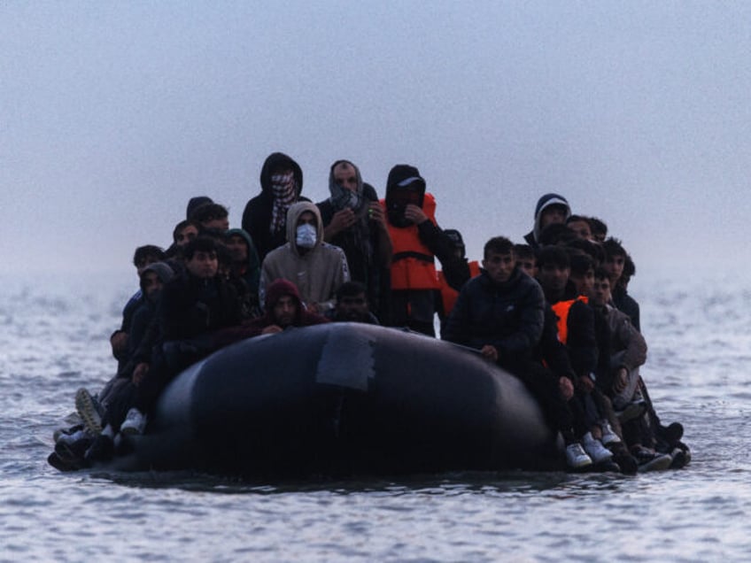 GRAVELINES, FRANCE - JUNE 13: Migrants make their way from the shore in a small boat on Ju