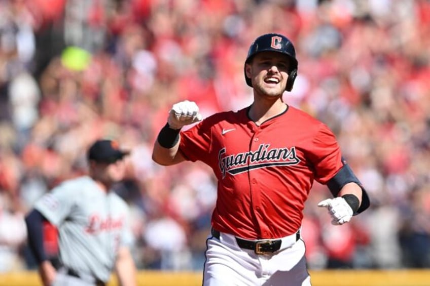 Cleveland's Lane Thomas rounds the bases after hitting a three-run home run in the first i