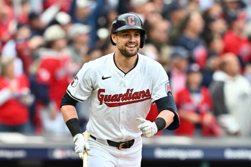 Cleveland's Lane Thomas celebrates after hitting a grand slam home run in the fifth inning