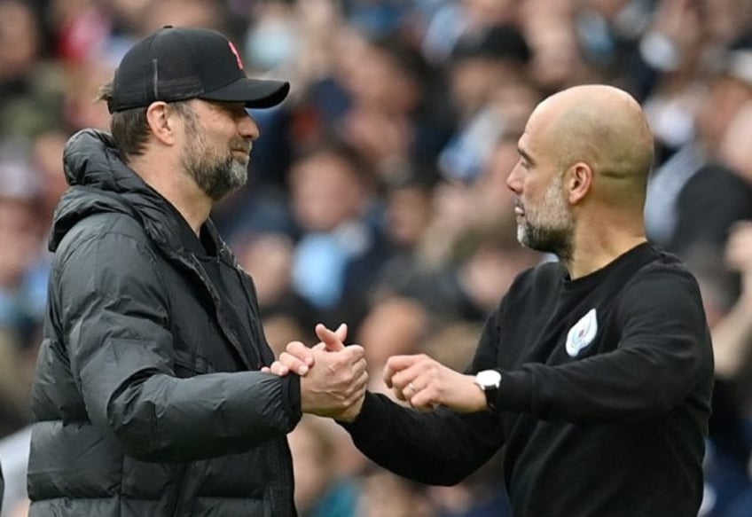 Liverpool manager Jurgen Klopp (left) shakes hands with Manchester City boss Pep Guardiola