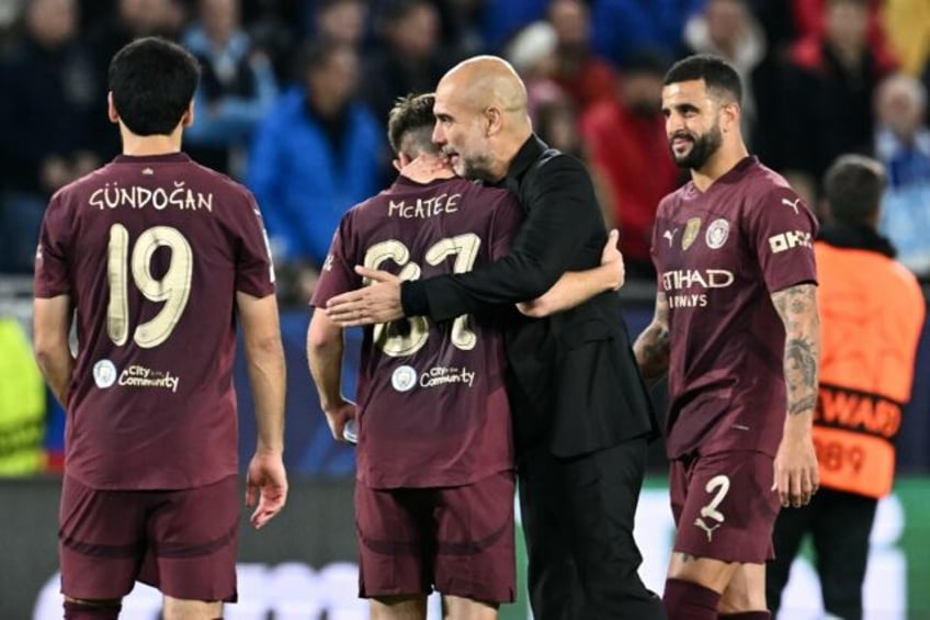 Manchester City manager Pep Guardiola celebrates with his players