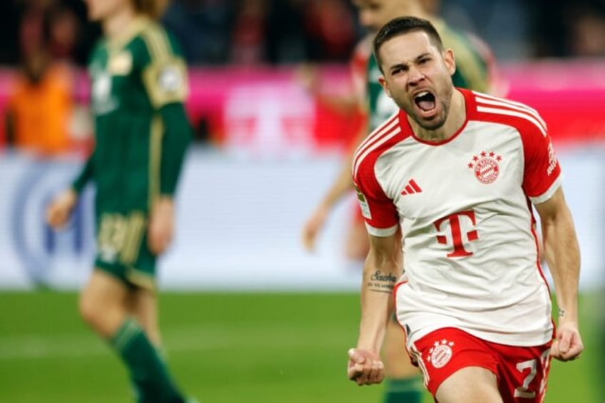 Bayern Munich's Portuguese defender Raphael Guerreiro celebrates his match-winning goal