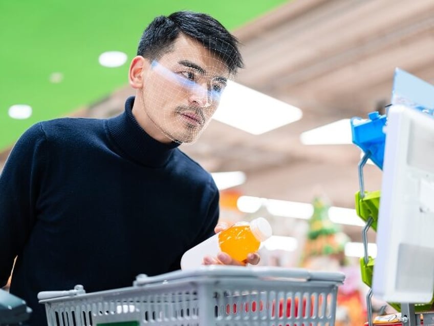 A shopper uses facial recognition