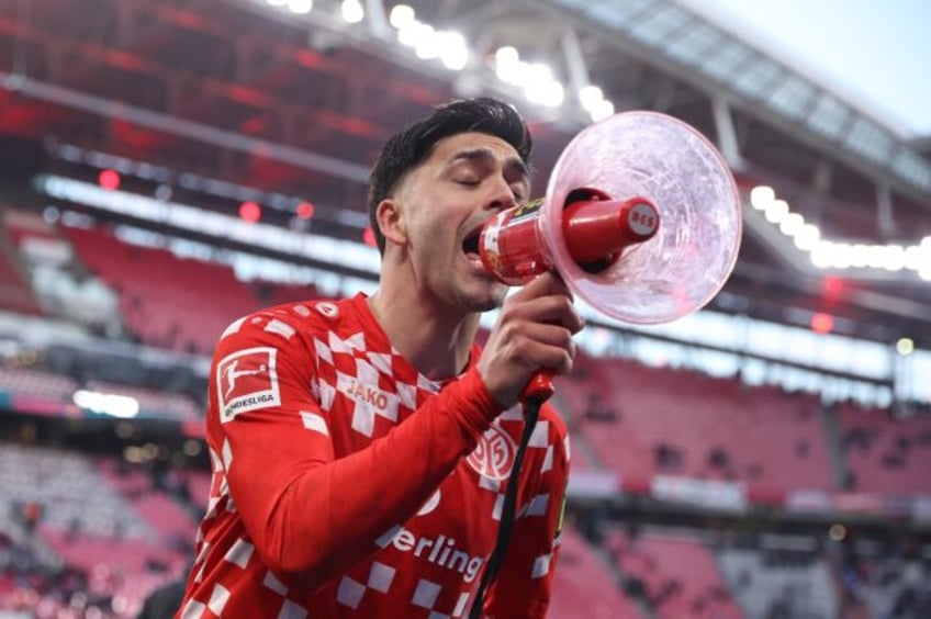 Something to shout about: Mainz midfielder Nadiem Amiri addresses fans after scoring in a