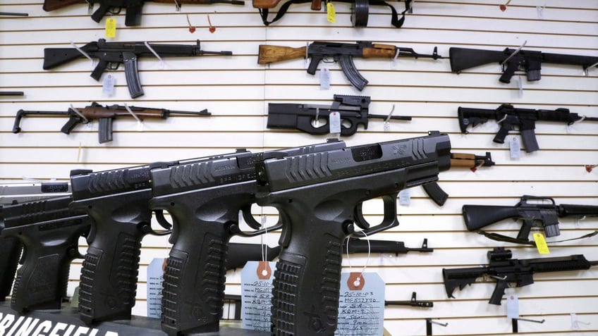 Pistols and rifles on display in an Illinois gun store