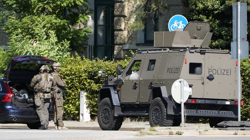 Police officers patrol after police fired shots at a suspicious person near the Israeli Consulate and a museum on the city's Nazi-era history in Munich, Germany, on Thursday, Sept. 5, 2024.