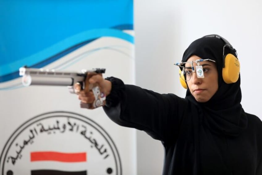 Yemeni air pistol shooter Yasameen al-Raimi trains ahead of the Paris Olympics in Sanaa on