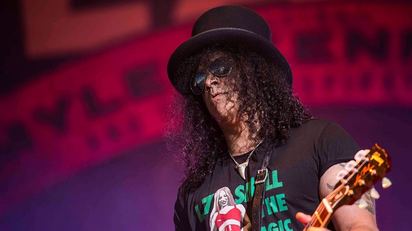 Slash performing on stage