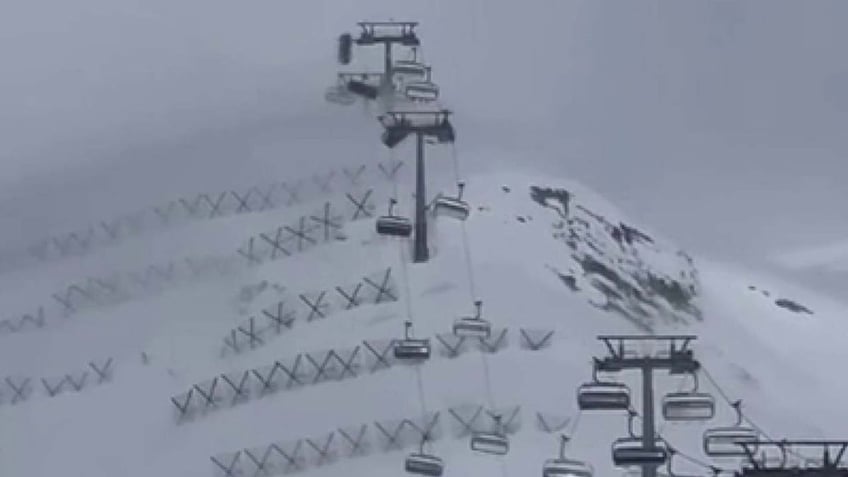 chair lift swinging in wind