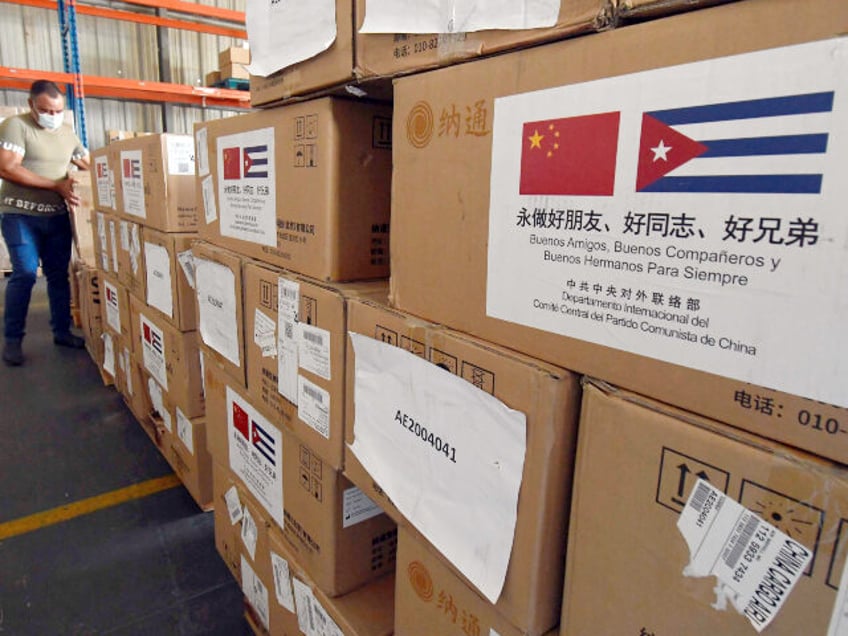A staff member transports medical supplies donated by the International Department of the