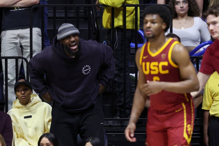 LeBron James of the Los Angeles Lakers shouts to his son, Bronny James of the USC Trojans, during Bronny's game against the California Golden Bears...