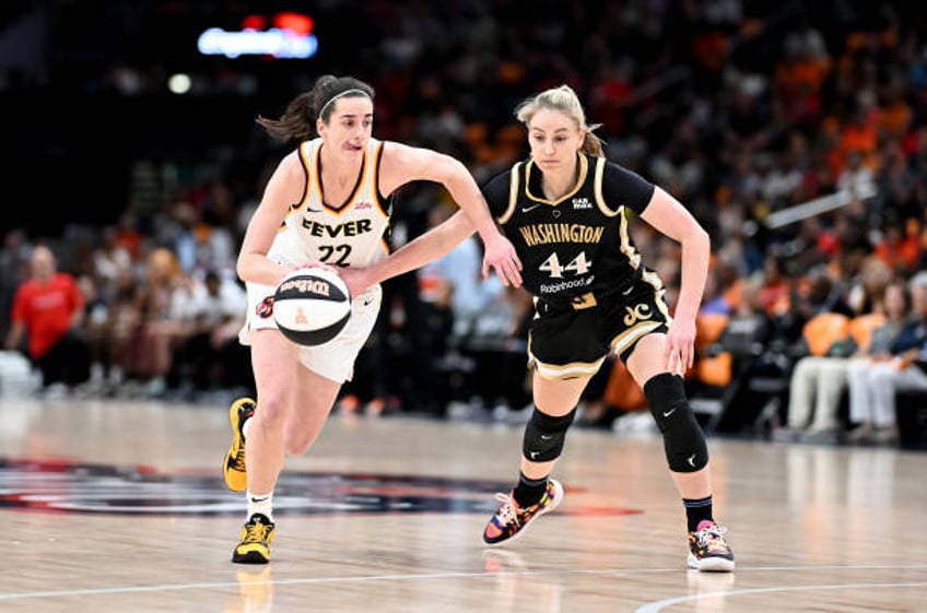 Caitlin Clark of the Indiana Fever handles the ball against Karlie Samuelson of the Washington Mystics at Capital One Arena on June 07, 2024 in...