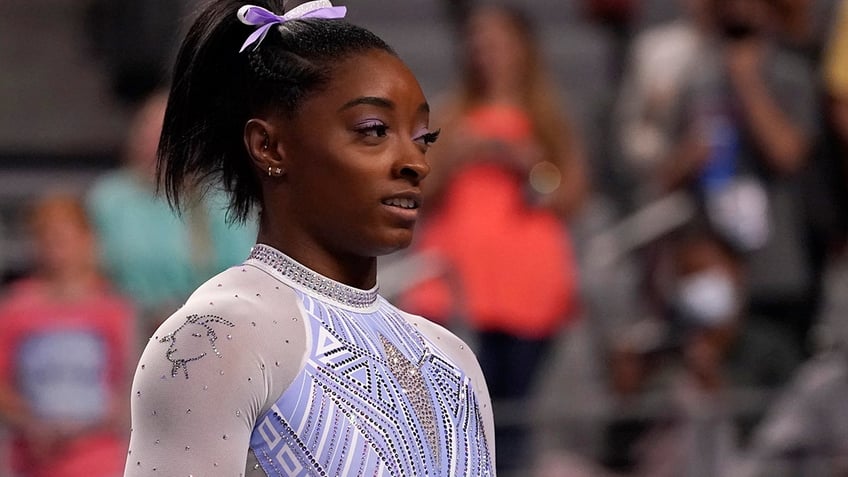 Simone Biles waits