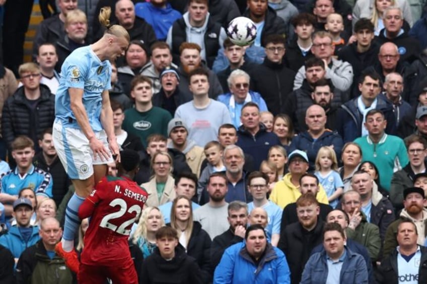 Erling Haaland (left) scored four goals in Manchester City's thrashing of Wolves