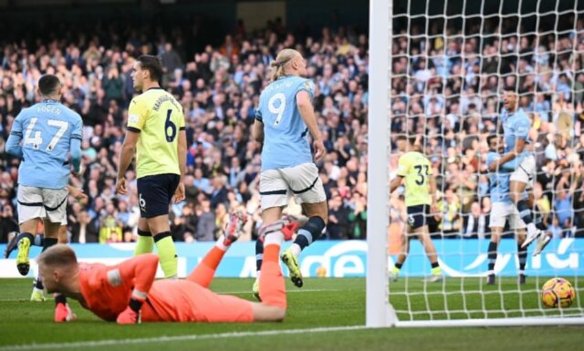 Early strike: Manchester City's Erling Haaland runs to celebrate after scoring the opening