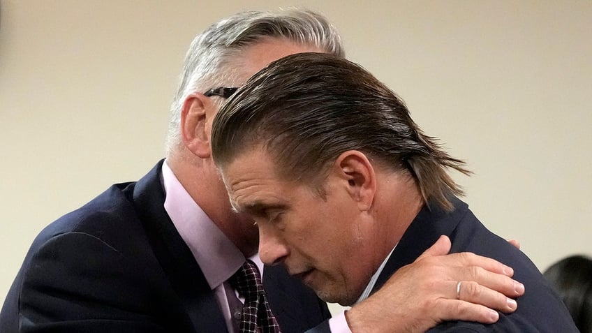 Alec Baldwin hugs Stephen Baldwin in court