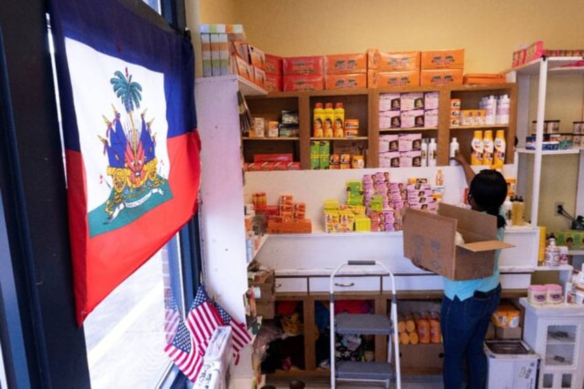 Creations Market shop owner Philomene Philostin, a naturalized US citizen of Haitian origi