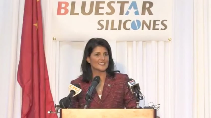 haley facing heat for bringing chinese company to south carolina standing next to ccp flag praising them