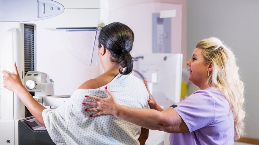 Woman getting mammogram