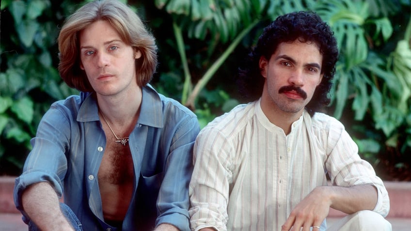 Daryl Hall and John Oates pose