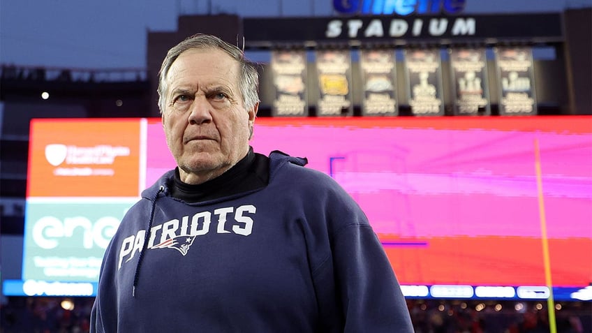 Bill Belichick walks off the field