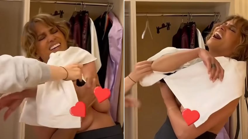 Halle Berry in two photos tries to get her shirt over her head with red hearts covering her boob area