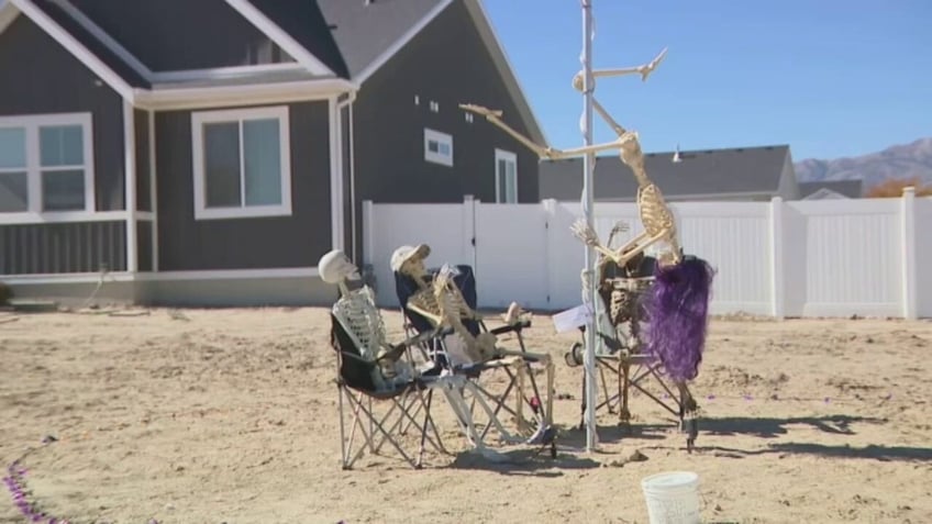 halloween skeletons pole dancing on a stop sign cause uproar in utah city all in the name of fun