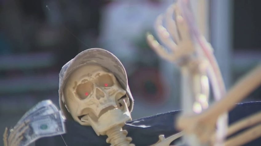 halloween skeletons pole dancing on a stop sign cause uproar in utah city all in the name of fun