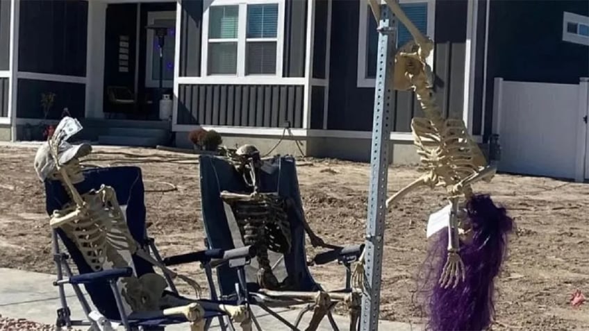 halloween skeletons pole dancing on a stop sign cause uproar in utah city all in the name of fun