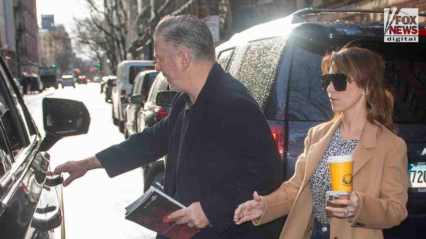 Alec Baldwin, who faces charges of involuntary manslaughter, gets into a car with wife, Hilaria Baldwin